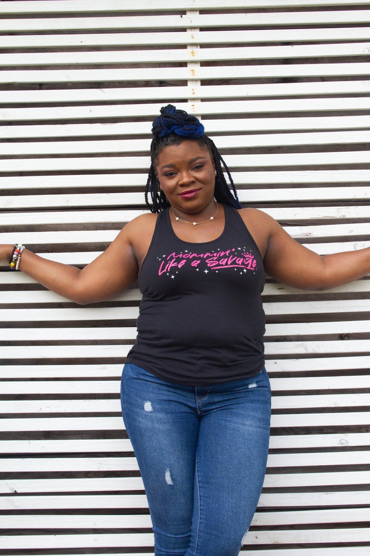 If you are Mommin' Like a Savage, this cute and trendy racerback tank top is for you. It is comfortable, lightweight, and versatile. This tank can be worn out on the town or going to the gym. The color scheme is a black with the Mommin' Like a Savage logo in pink with white stars on the front chest. Made with 4 oz. 60/40 cotton poly, this lightweight jersey drapes nicely against the body. These tanks are true to size and pre-laundered to reduce shrinkage.