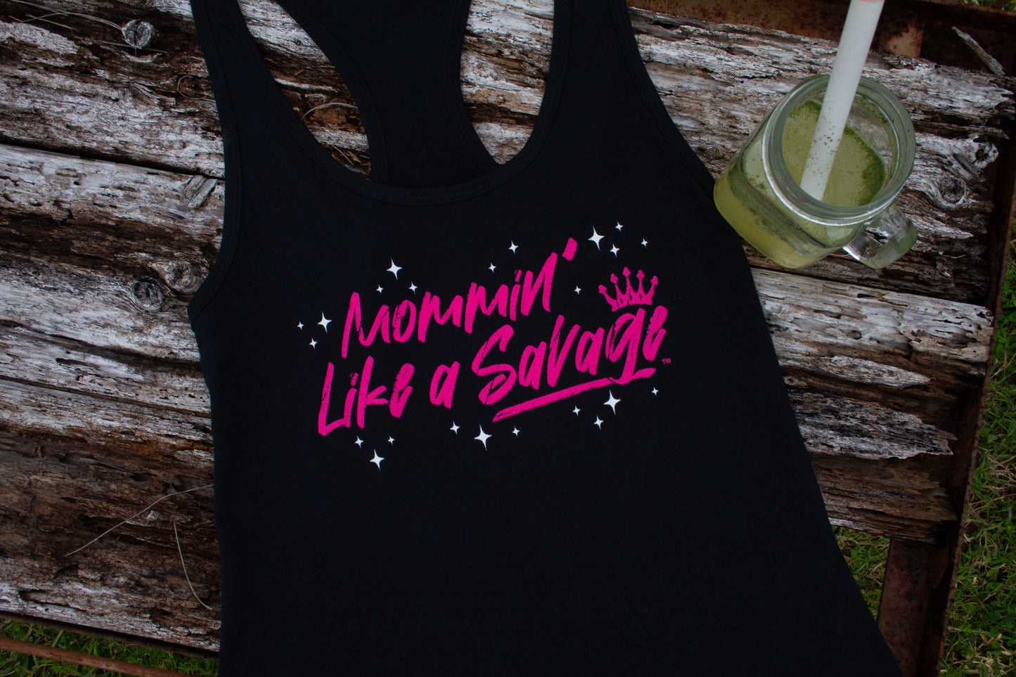 If you are Mommin' Like a Savage, this cute and trendy racerback tank top is for you. It is comfortable, lightweight, and versatile. This tank can be worn out on the town or going to the gym. The color scheme is a black with the Mommin' Like a Savage logo in pink with white stars on the front chest. Made with 4 oz. 60/40 cotton poly, this lightweight jersey drapes nicely against the body. These tanks are true to size and pre-laundered to reduce shrinkage.